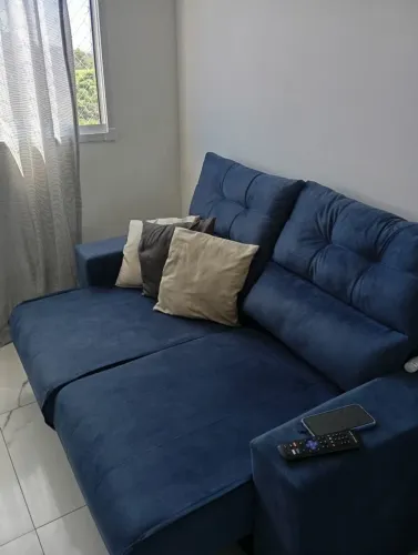 sofá cama, dois lugares azul claro, em perfeito estado, só está com um leve defeito.