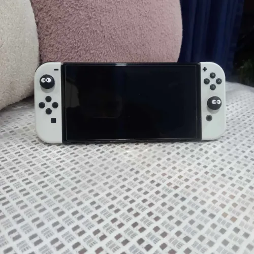Nintendo Switch OLED 64gb + 128gb card