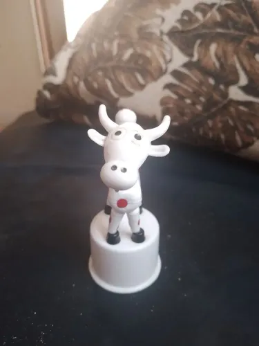 Vaquinha de brinquedo que se mexe