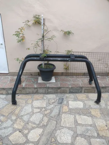 SANTO ANTÔNIO TUBULAR DUPLO ORIGINAL PARA PICK-UPS TOYOTA ANO1994 A 2004 COM SUPORTE FAROL