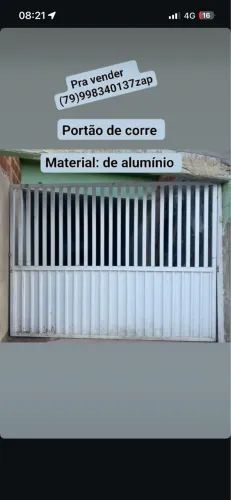 Portão em perfeito estado, esta sujo pq pegou pueira da reforma da casa
