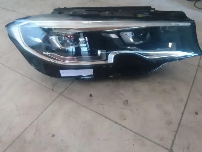 Farol bmw 320 lado direito passageiro