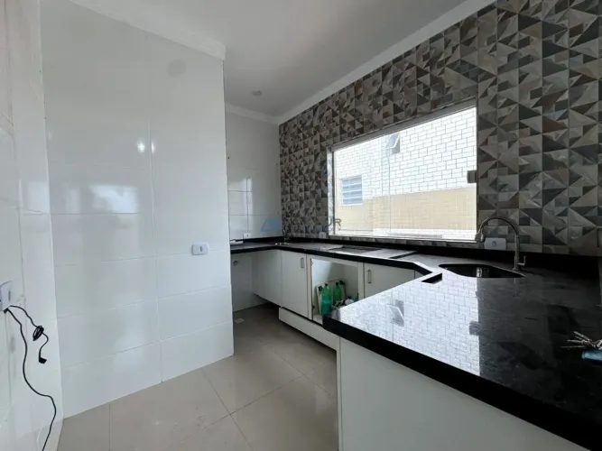 Casa de condomínio sobreposta alta à venda em Praia Grande no bairro Mirim