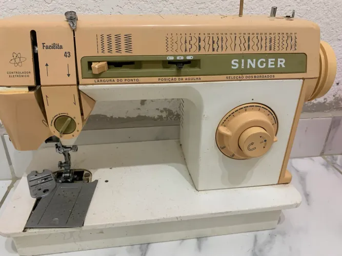 Máquina de coagida Singer