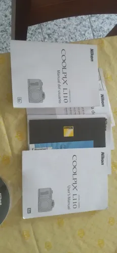 Manuais e disco de instalação da câmera fotográfica Nikon digital l110