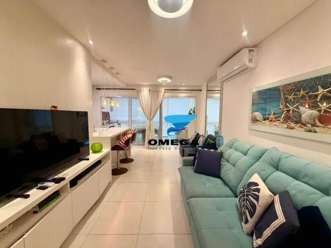 Apartamento novo à venda na praia do Tombo no Guarujá I Omega Imoveis