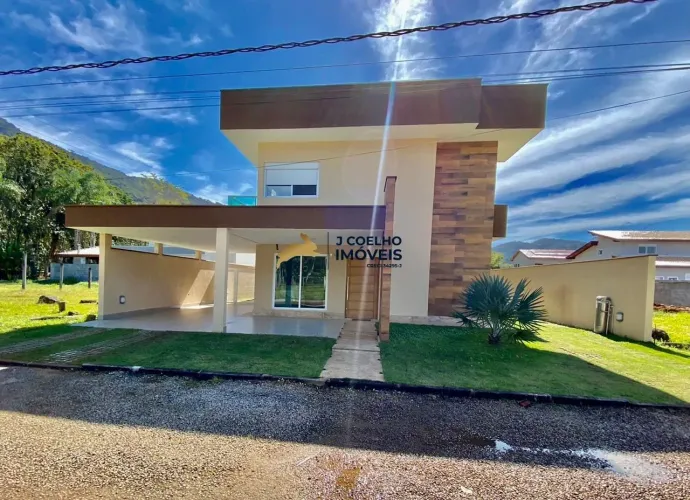 Casa em condomínio com 4 suítes, piscina e sauna na Praia da Lagoinha - SP
