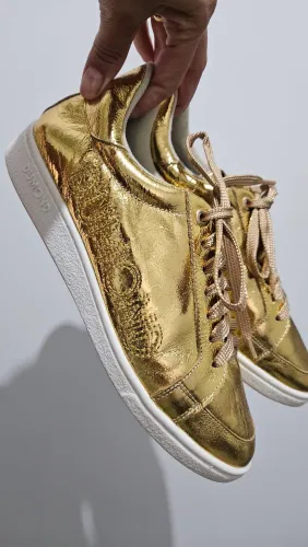 Tênis dourado Dumond