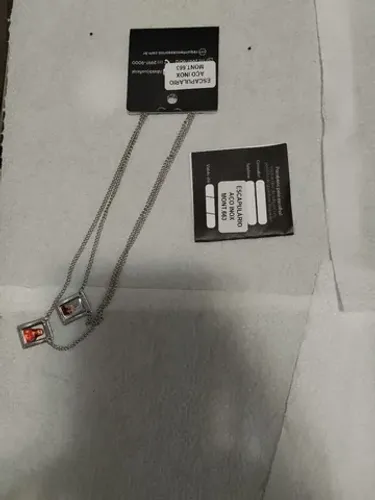 Escapulário em aço inox