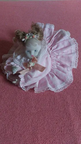 boneca dorminhoca de porcelana