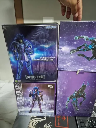 Cloth myth-3 cavaleiros Saga,Shura,Camus leia o anuncio