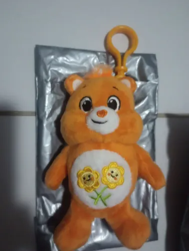 Ursinho carinhoso laranja flor pelúcia Cacau show chaveiro lançamento