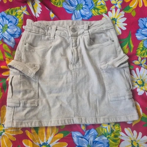Saia jeans com bolso lateral 