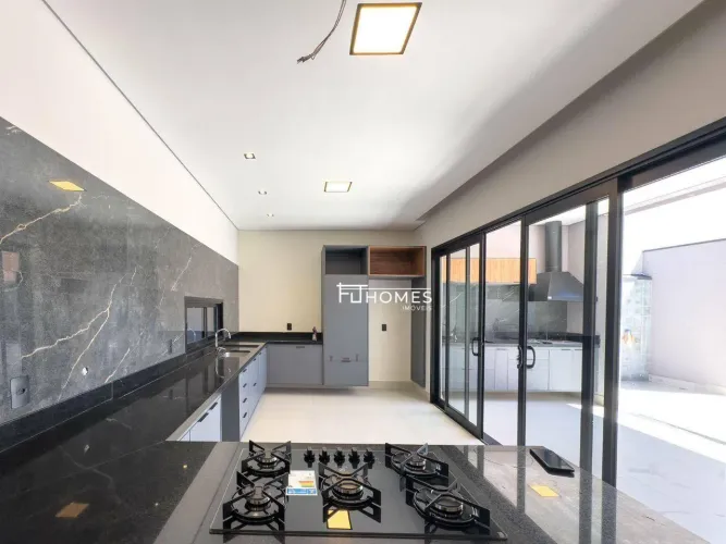 Casa com 3 dormitórios à venda, 210 m² por R$ 2.100.000,00 - Condomínio Dona Lucilla - Ind