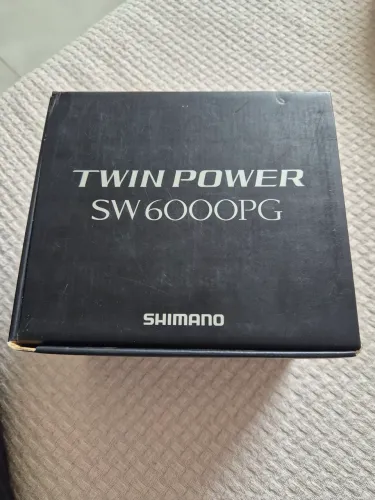 Molinete Twin power sw 6000 pg
