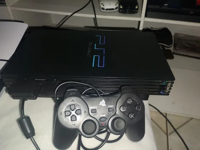 Playstation 2 FAT com dois memory card um controle leitor funcionando vai alguns jogos de