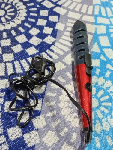 Vende se uma chapinha que caracolas os cabelos