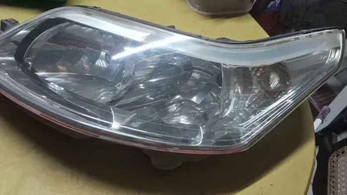 Farol C4 Pallas esquerdo original