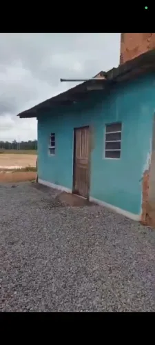 Vendo um terreno com cinco kitnet e estrutura pra mas 4 por 450 mil