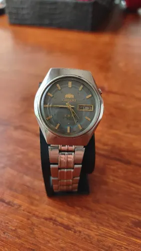 Relógio Orient Automático Vintage Cinza detalhe circular azul prateado
