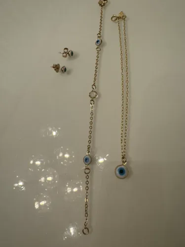 Vendo conjunto de colar, brinco, pulseira, tornozeleira - olho grego.