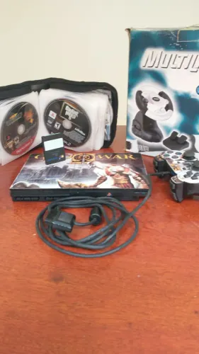 PS2(Normal ou Ferrari)+1 Joystick+1 Memory Card+10 DVD's+ Volante (Aceito Troca)