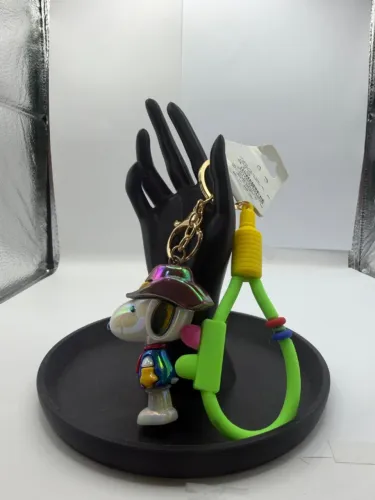 Chaveiro Snoopy astronauta cowboy alça verde