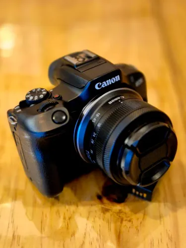 Canon R100 com lente, Carregador e Bateria do Kit