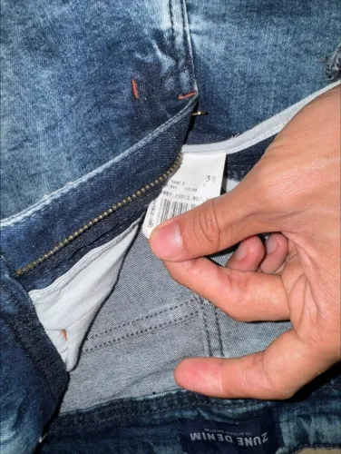calça masculina jeans com detalhes rasgados tamanho 38