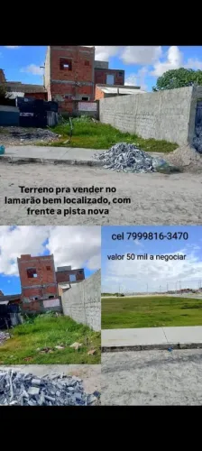 Terreno a venda no Lamarão enfrente a pista nova ótima localização.