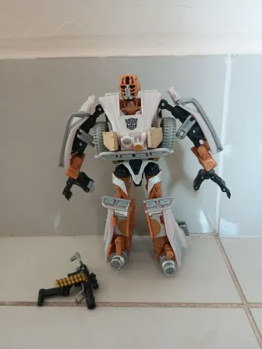 Boneco Comettor deluxe transformers dotm hasbro