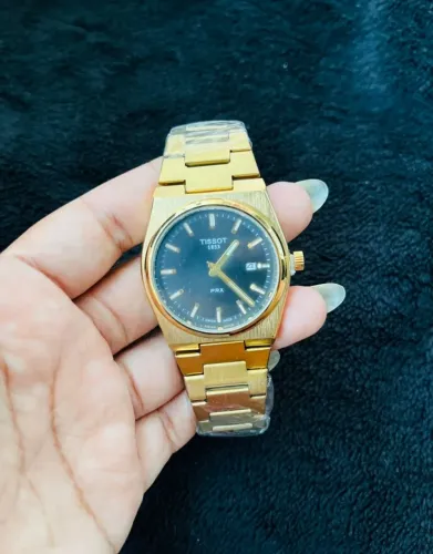 Relógio tissot dourado