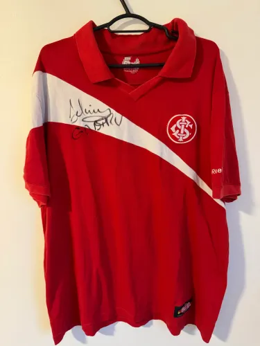 Camisa polo Reebok internacional autografada