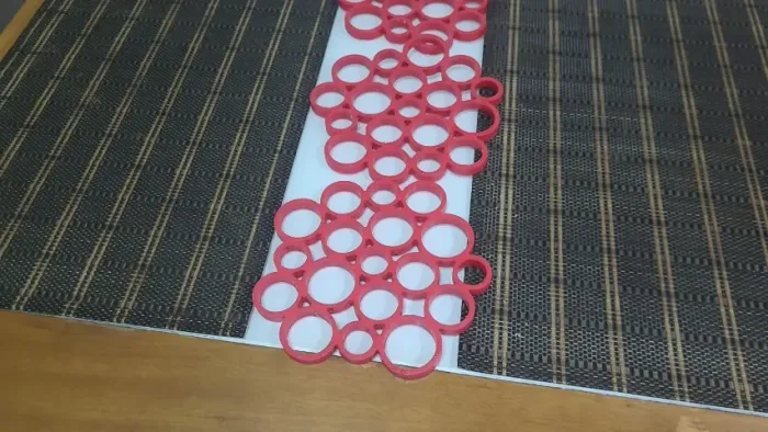 Jogo Americano com 6 peças em textilene e 3 descanso de panela silicone vermelhas