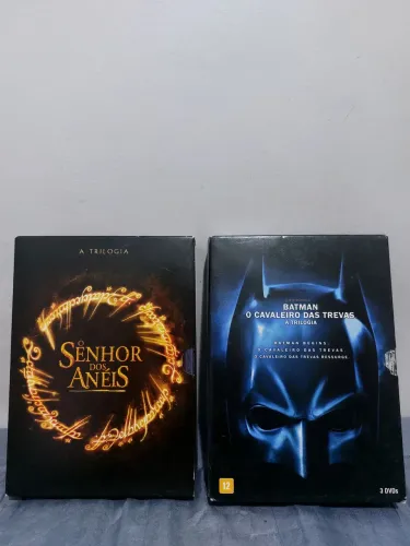 1 Box do senhor dos anéis + 1 Box do Batman(ambos com 3 DVDs cada)