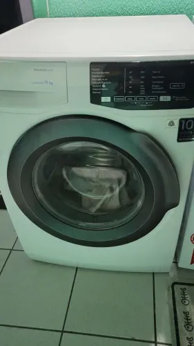 Máquina de lavar roupas com defeito
