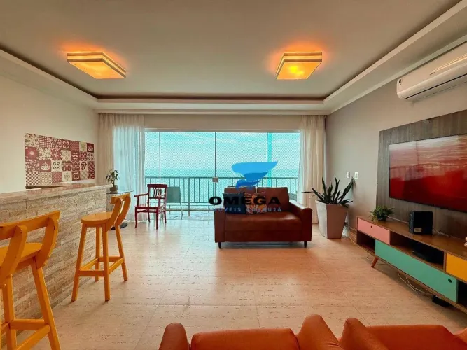 Apartamento frente mar à venda na praia das Pitangueiras no Guarujá I Omega Imoveis