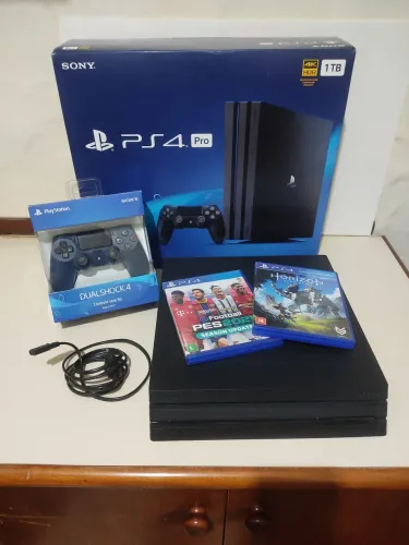 Ps4 pro preto 1tb,com controle dual shoks 4 azul.