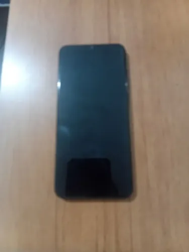 Celular Samsung 0A4E com capinha