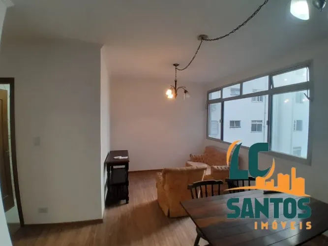 Apartamento na praia do Embaré - Prédio com piscina e quadra esportiva - 2 vagas .