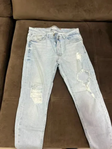 Calça Zara 44 modelo rasgado Jeans