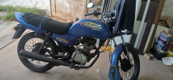 Moto CG 99 impecável.