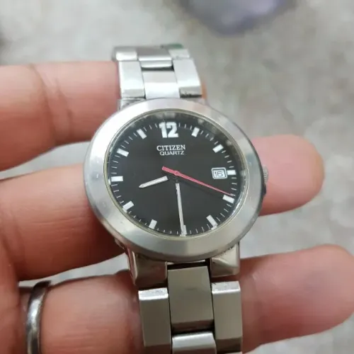 Relogio Citzem todo em aço com calendário 