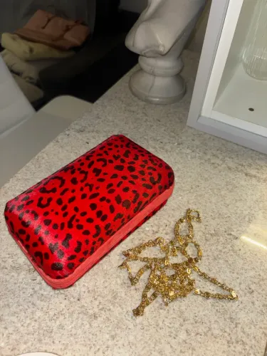 Bolsa Schütz clutch animal print