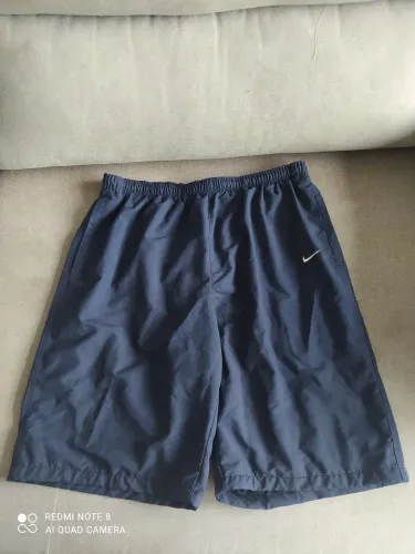 Bermuda corta vento Nike azul g