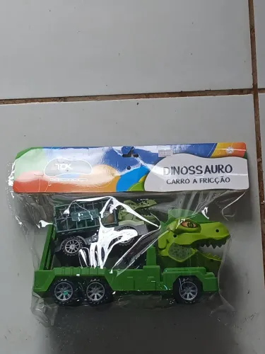 Brinquedo carro com cabeça formato dinossauro 