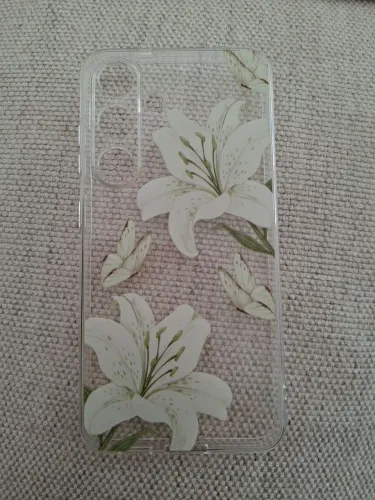 Capinha Galaxy S25 transparente de flores brancas. 