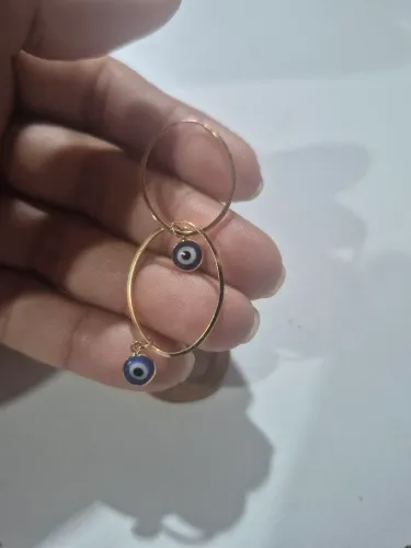 Vendo argola de ouro com pingentes de olho grego