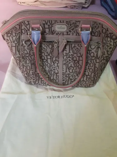 Bolsa marca vitor Hugo original estado de nova.tecido jacard