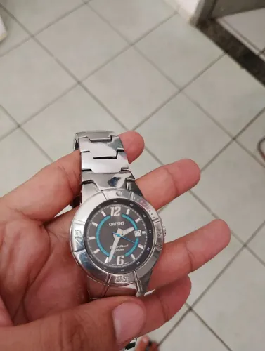 Vendo relógio oriente todo de aço original funcionando perfeitamente 